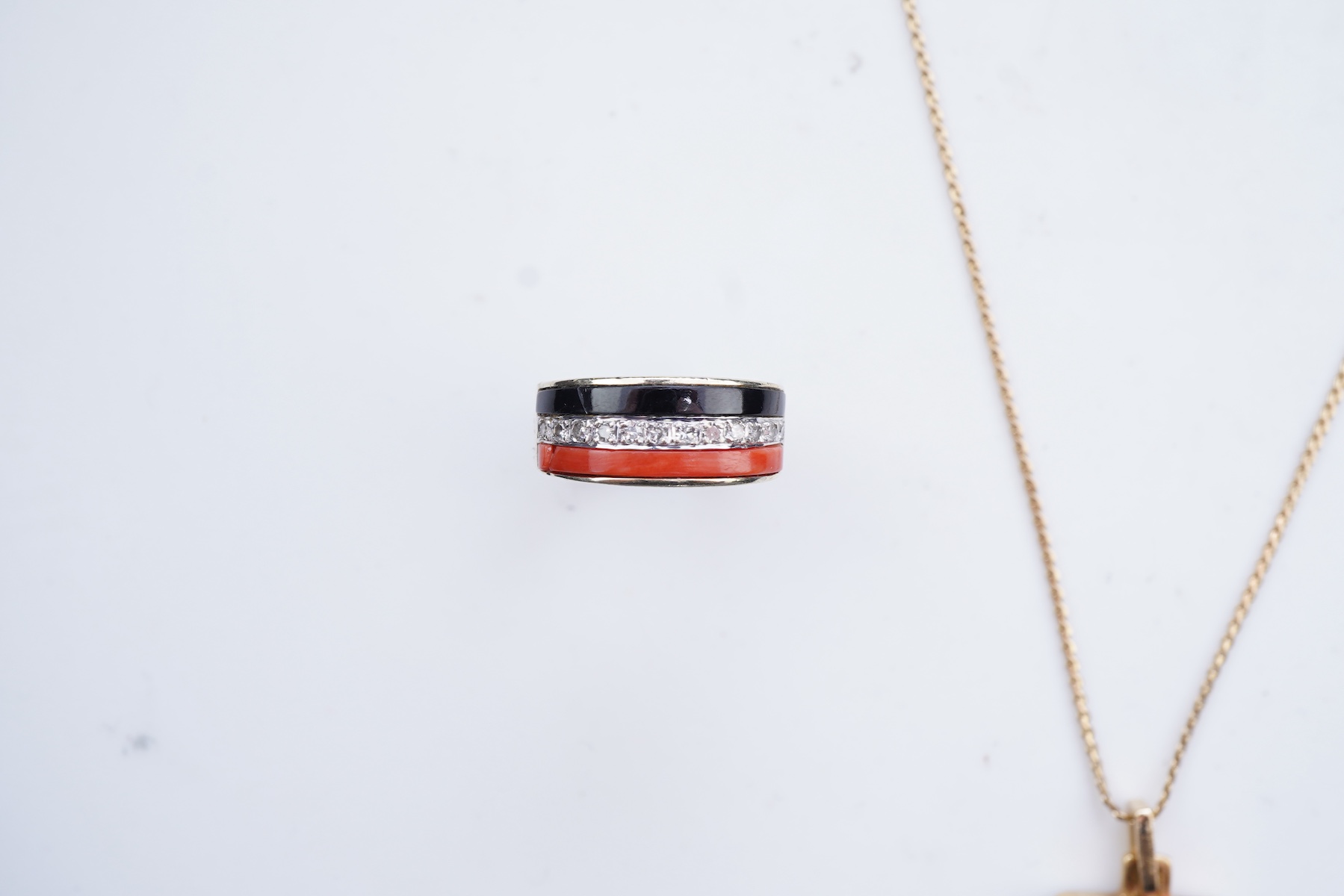An onyx, coral and diamond demi-parure, circa 1976-7